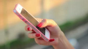 stock-footage-girl-using-mobile-phone-smartphone